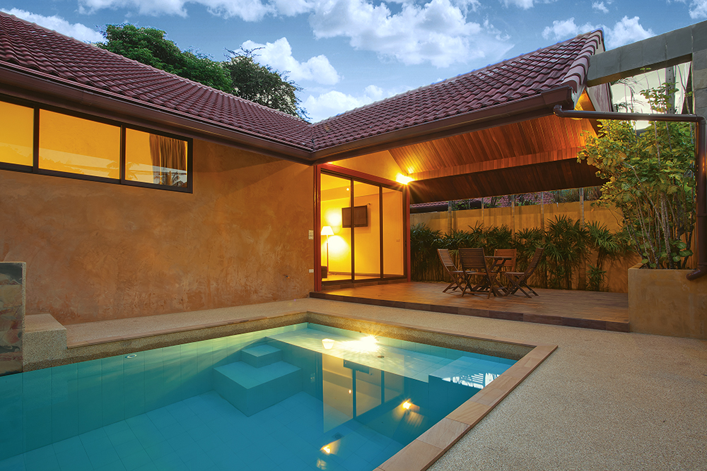 Exterior of the patio of a house with a swimming pool