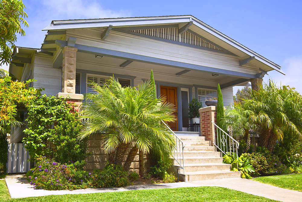 A traditional home with a green entrance in California.